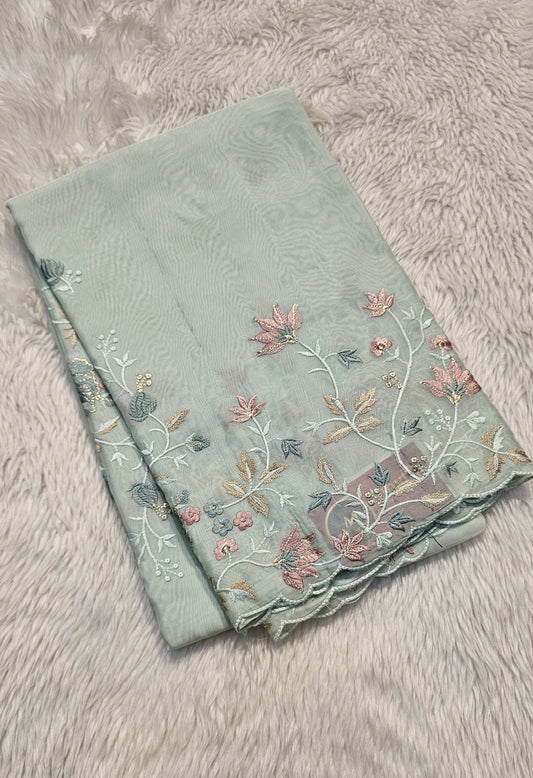 Semi organza fancy saree in light sea green self with allover embroidery work