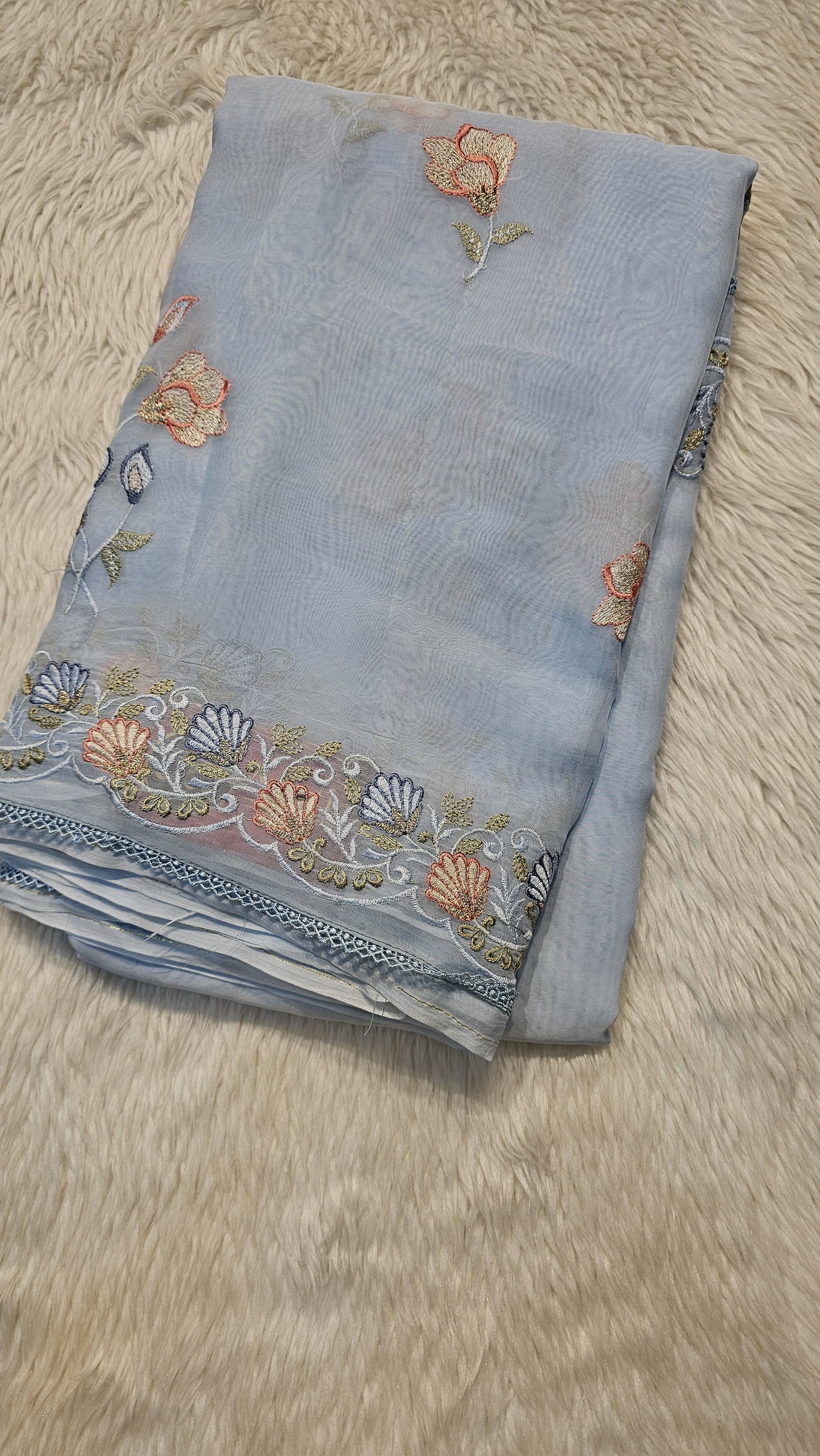 semi organza fancy saree in ice blue self with allover embroidery work