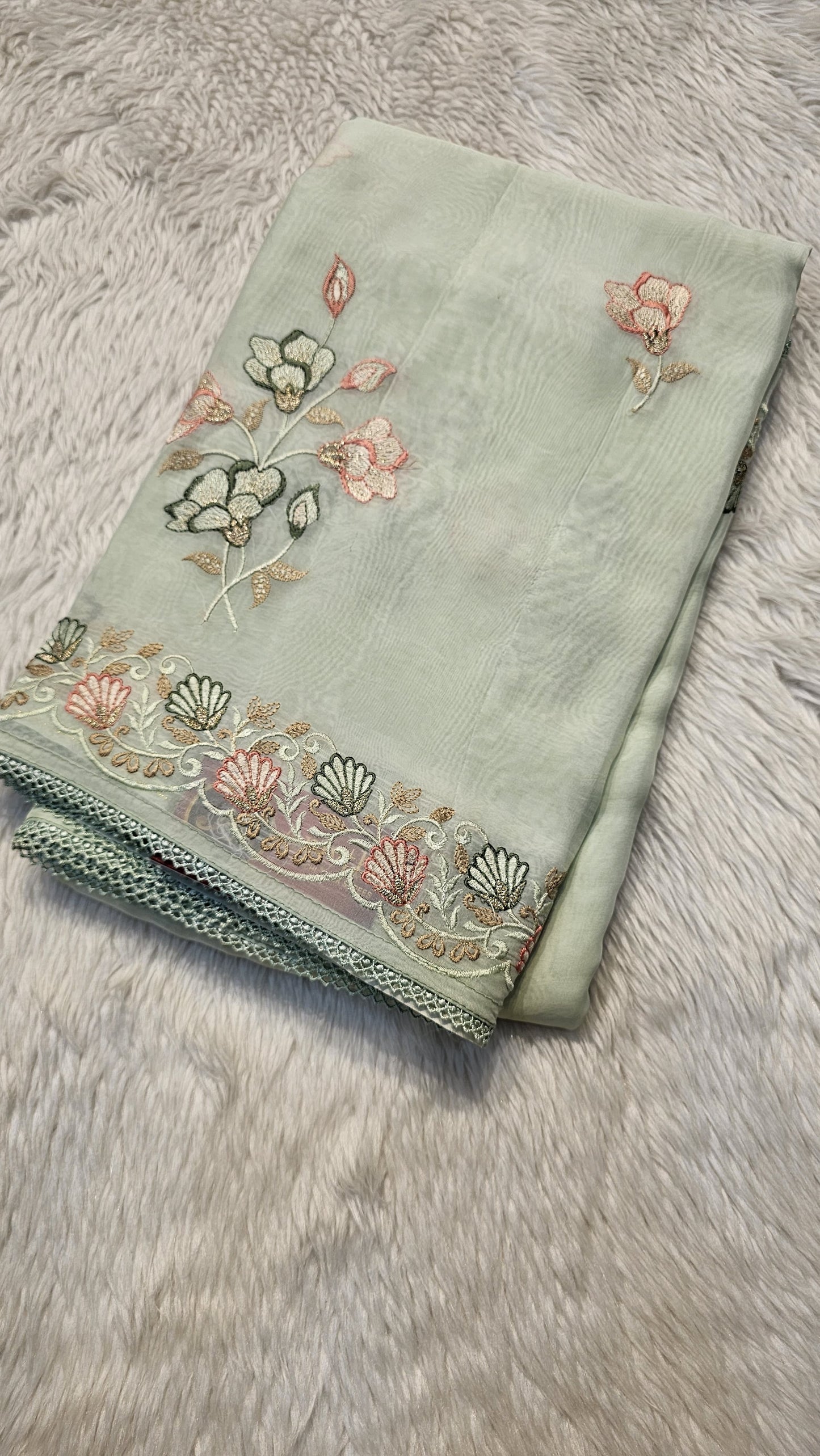 semi organza fancy saree in light pista self with allover embroidery work