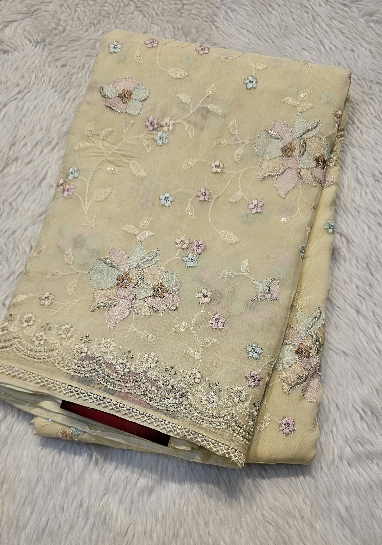 semi organza fancy saree in light yellow self with allover embroidery work