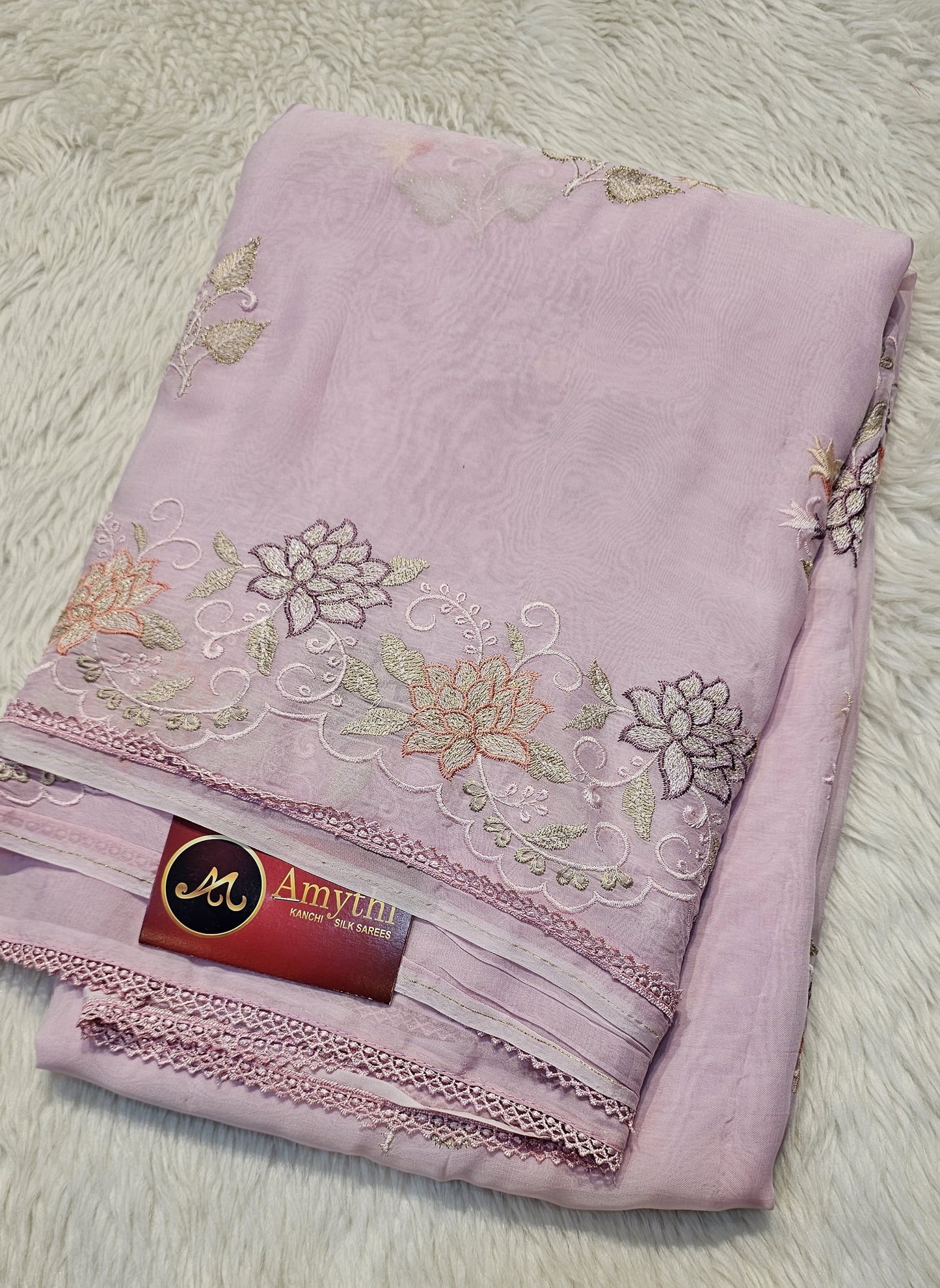 semi organza fancy saree in light lavender with allover embroidery work