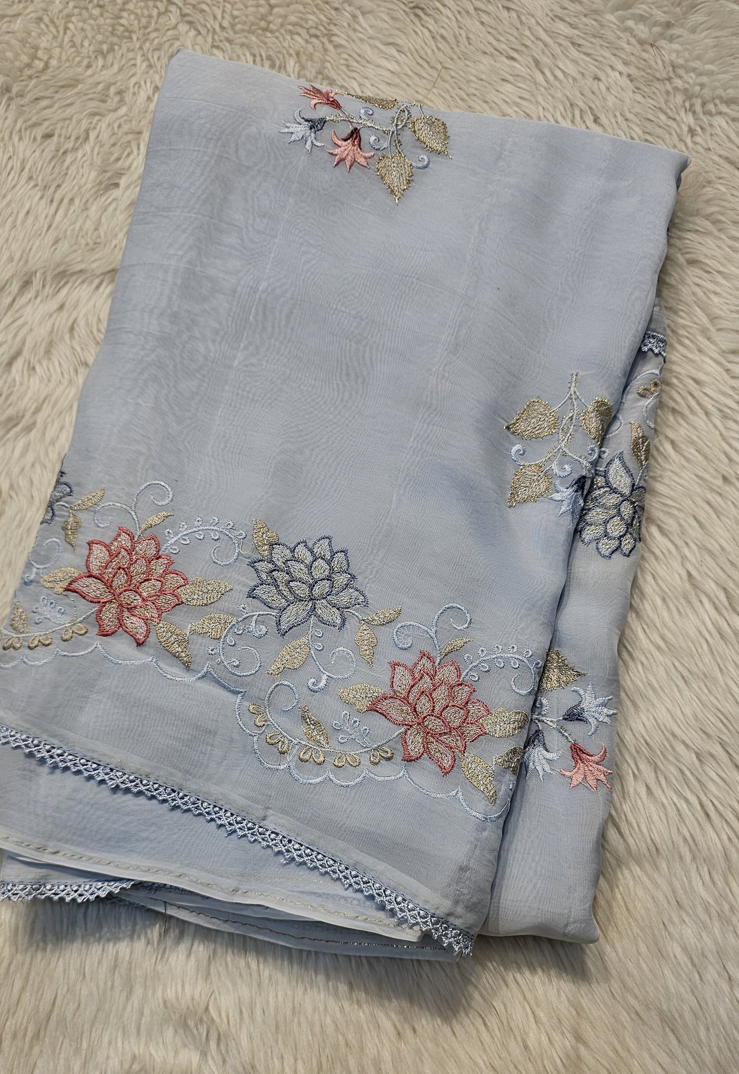 semi organza fancy saree in light blue self with allover embroidery work