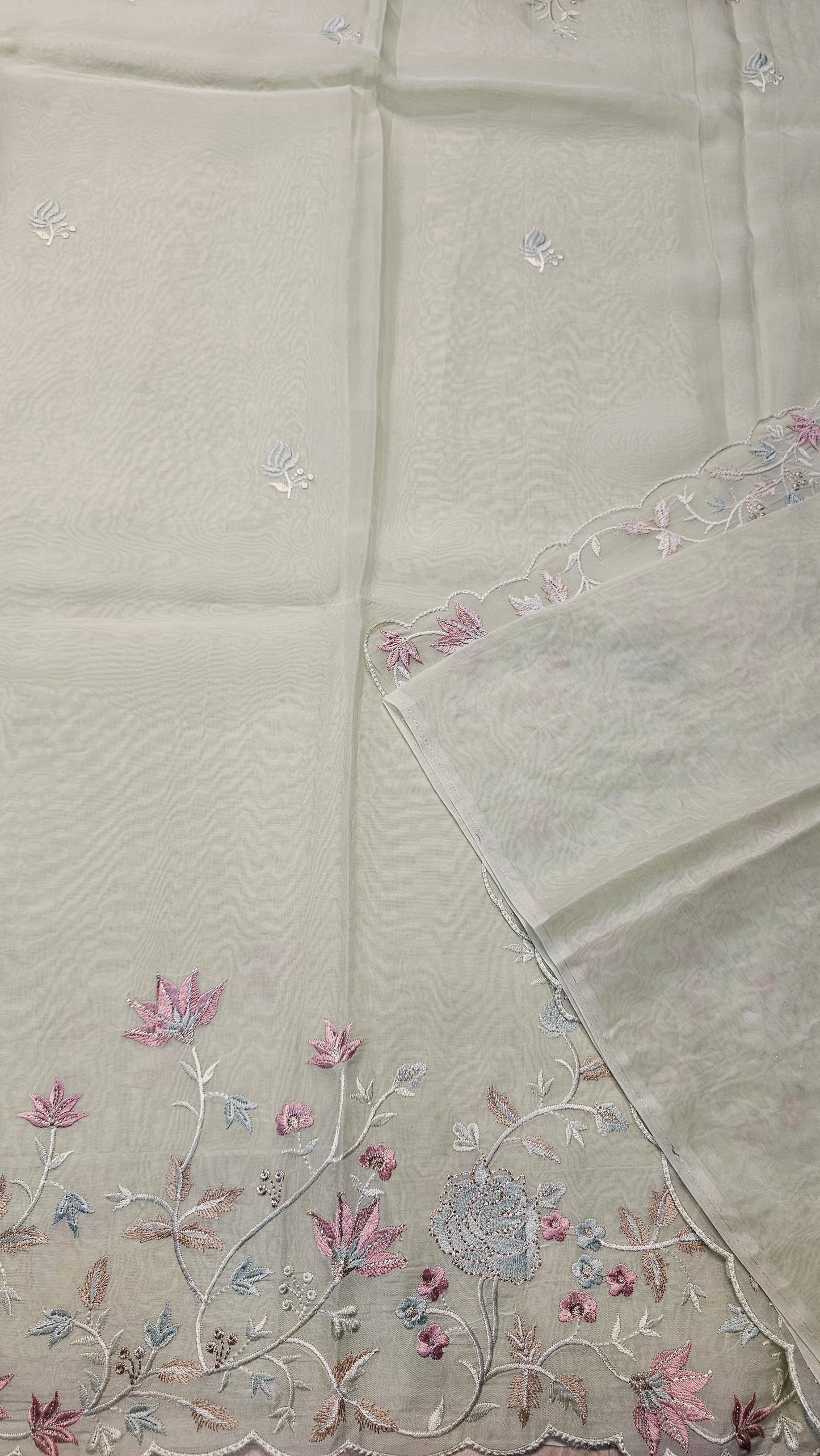 Semi organza fancy saree in light sea green self with allover embroidery work