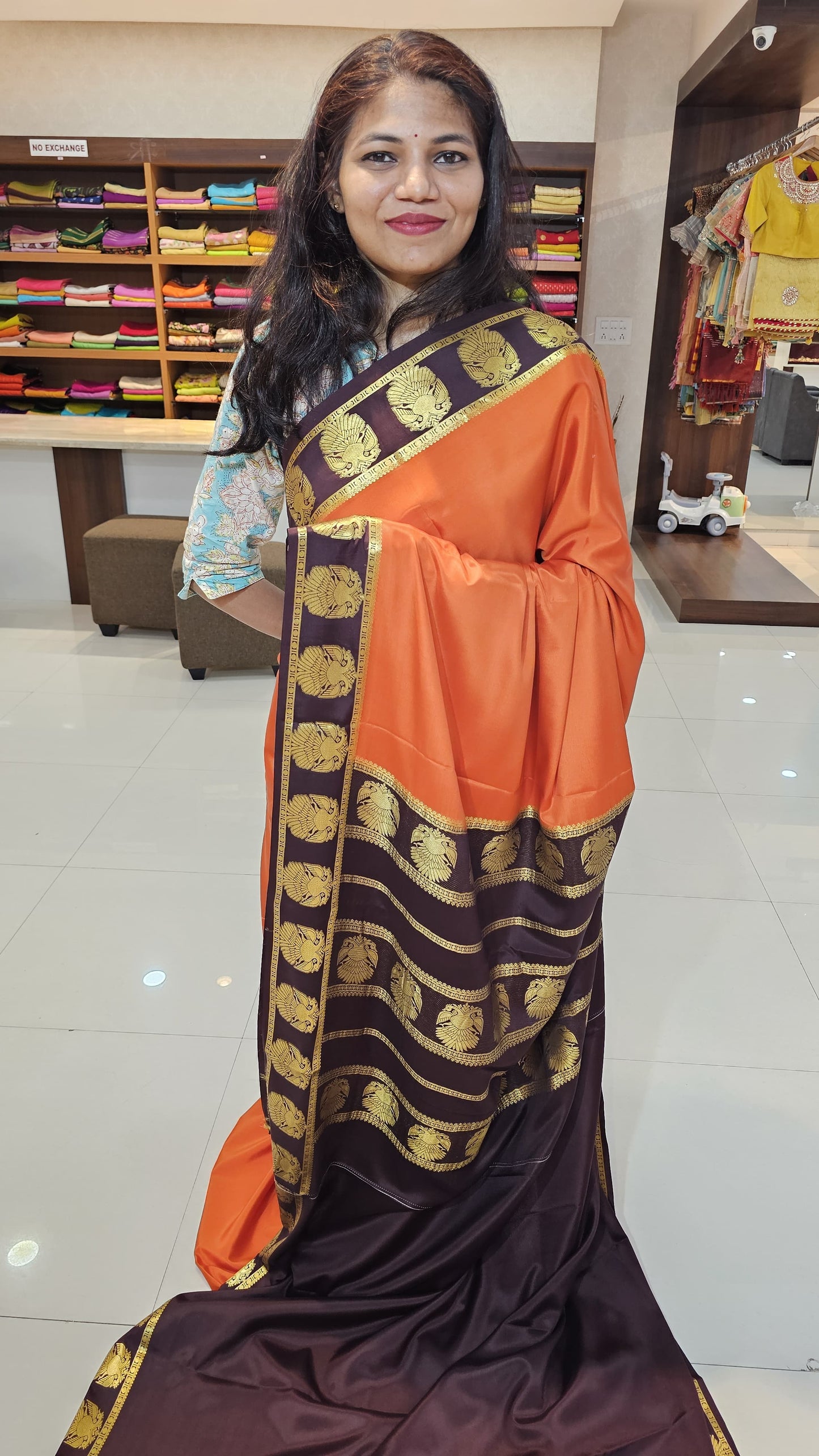 mysore crepe silk sarees in KSIC Finish in rust orange with dark brown ganda berunda border pattern