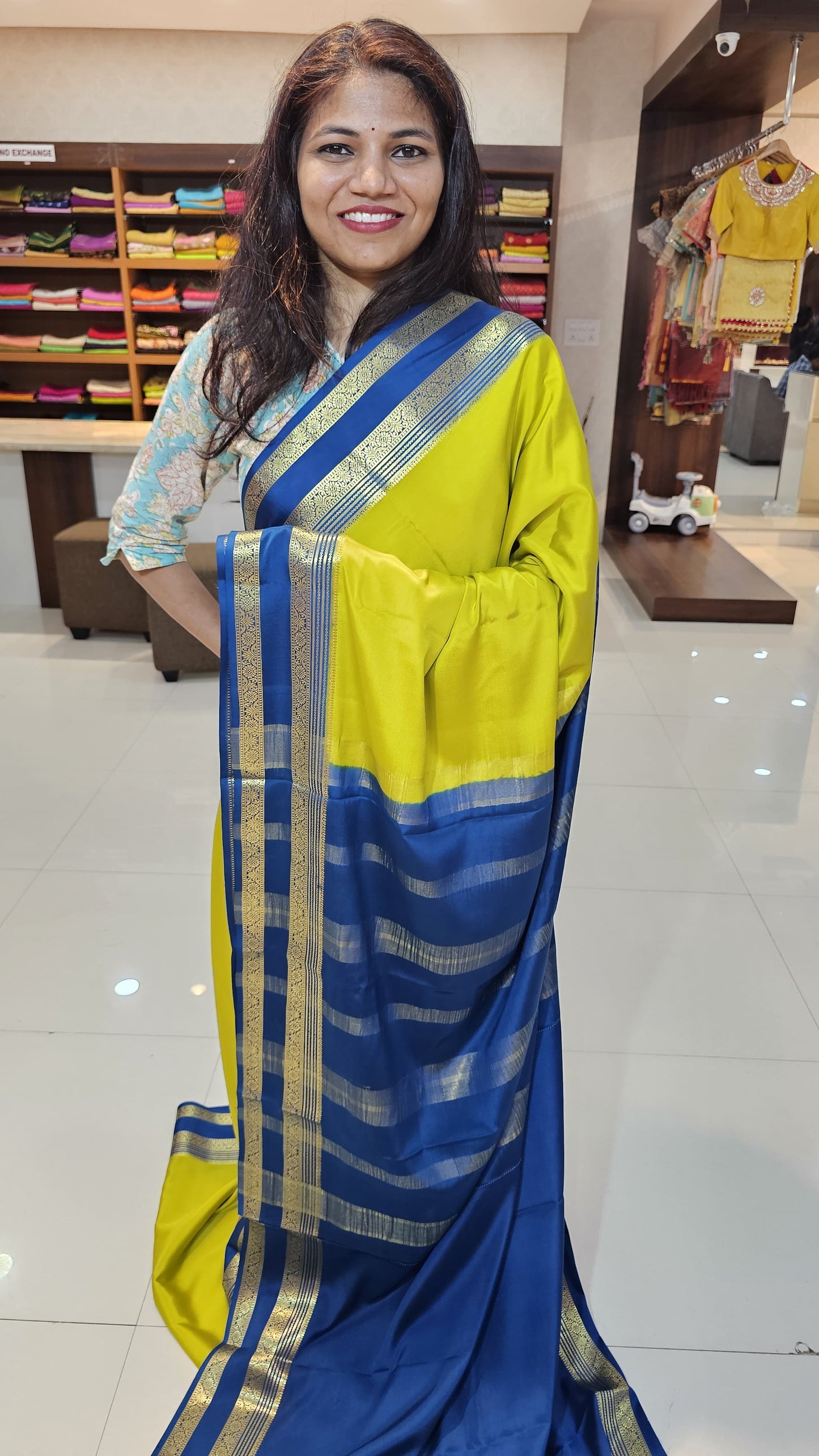 mysore crepe silk sarees in KSIC Finish in light mehendi green with peacock blue bentex border
