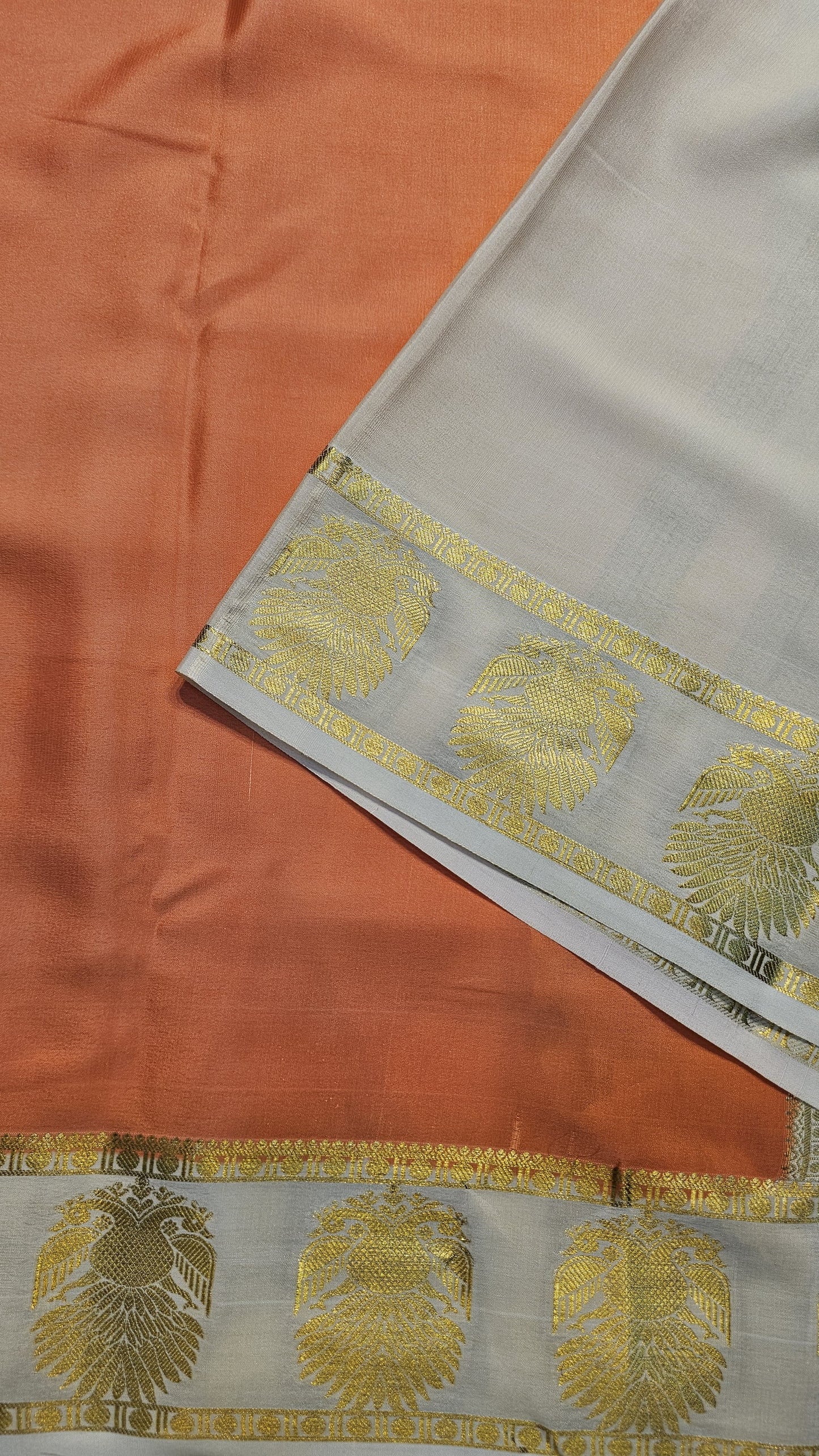 mysore crepe silk sarees in KSIC Finish in peach with half white in ganda berunda border