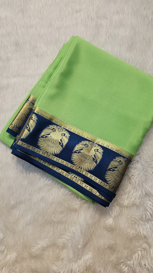 Mysore Crepe Silk Sarees in KSIC Finish in mint green with peacacok blue ganda berunda border border