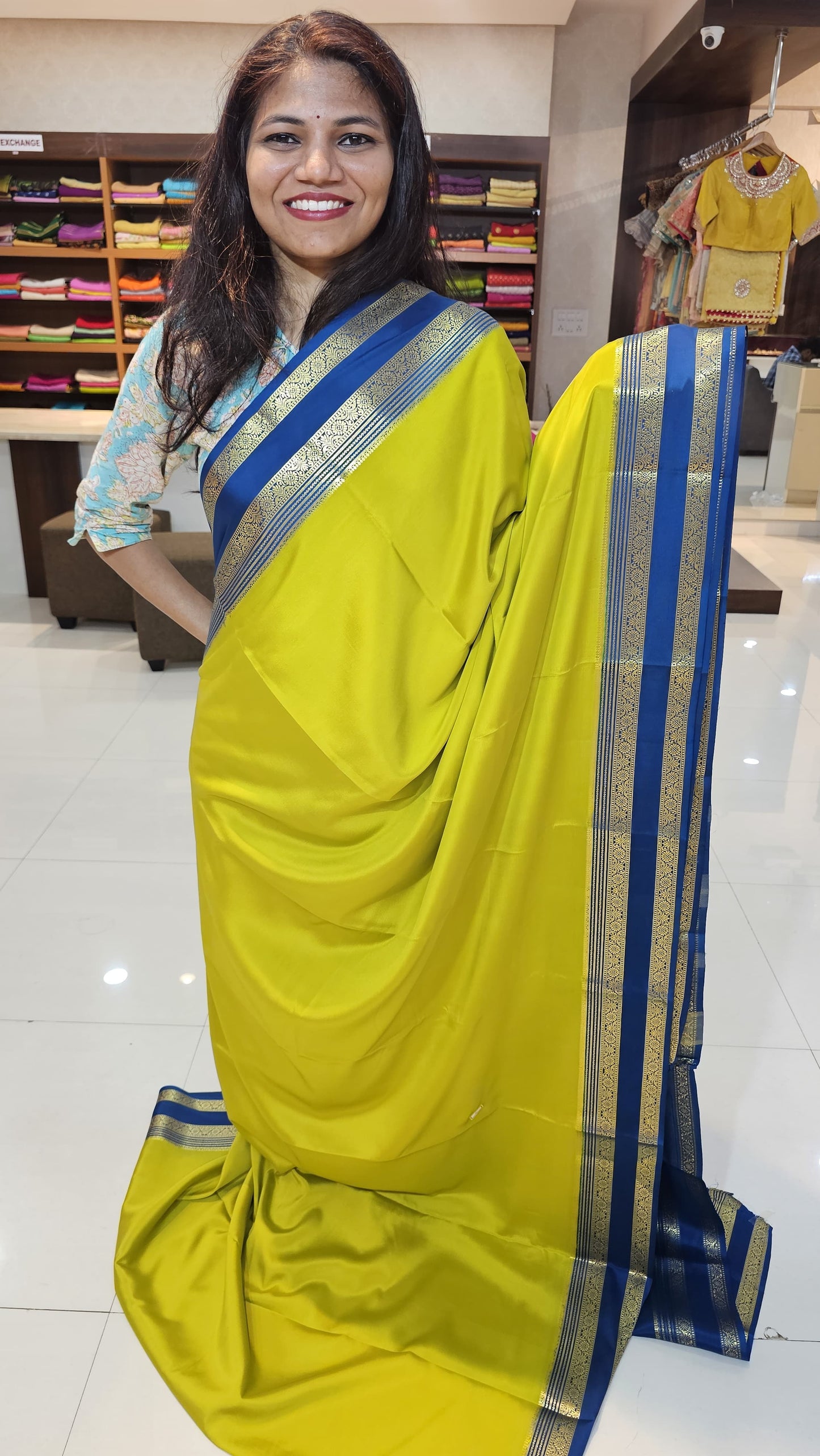 mysore crepe silk sarees in KSIC Finish in light mehendi green with peacock blue bentex border