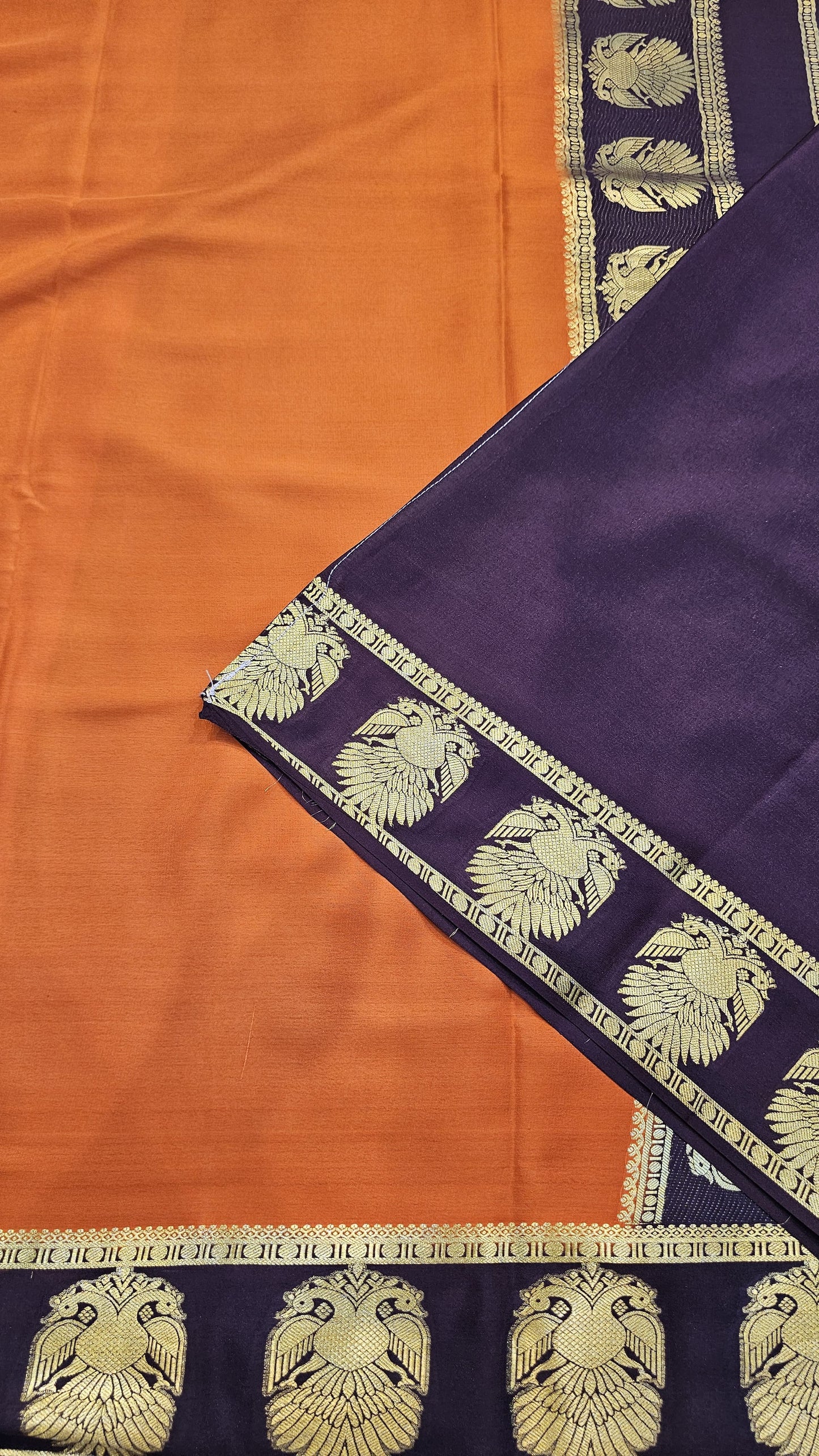 mysore crepe silk sarees in KSIC Finish in rust orange with dark brown ganda berunda border pattern