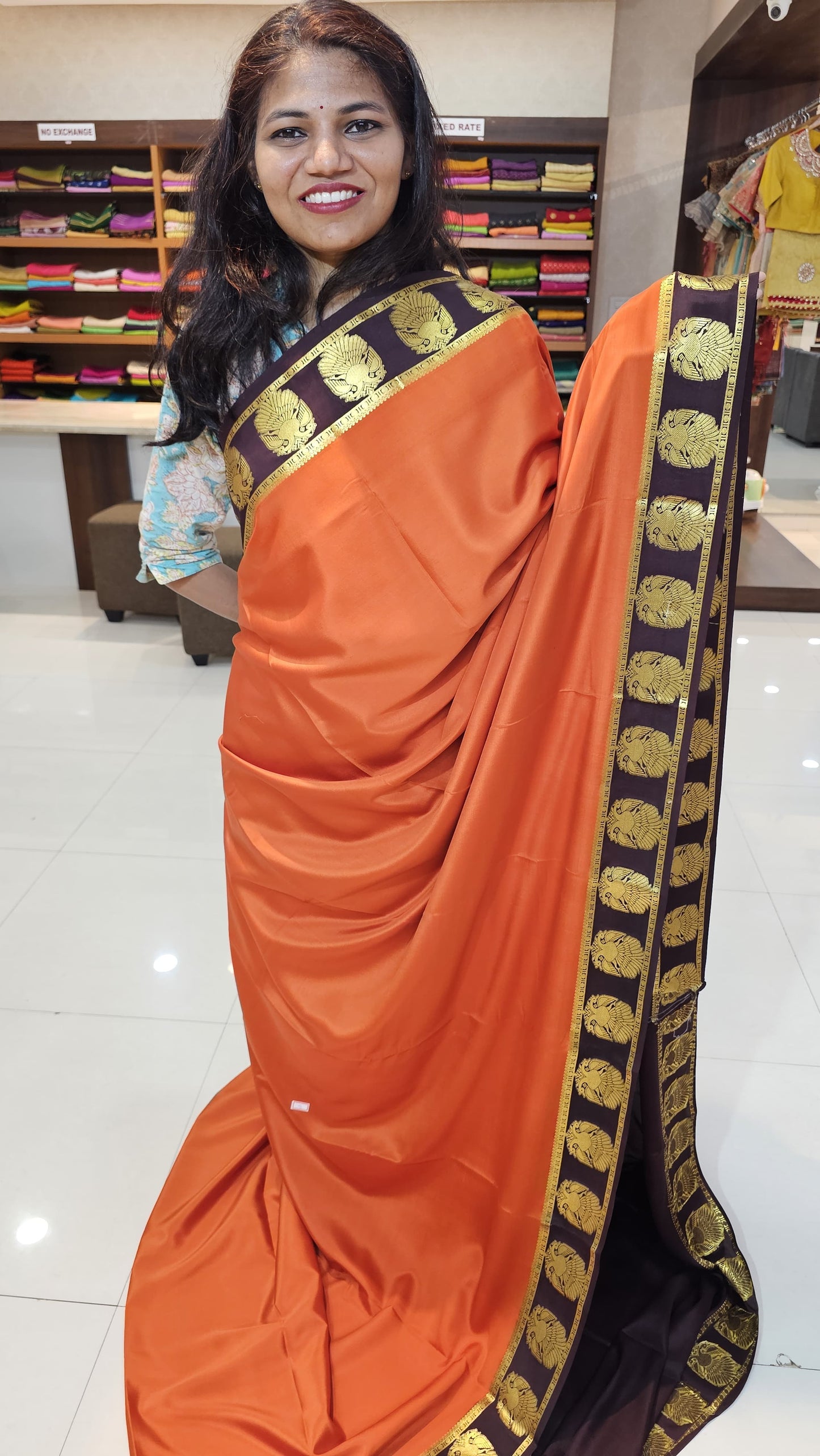 mysore crepe silk sarees in KSIC Finish in rust orange with dark brown ganda berunda border pattern