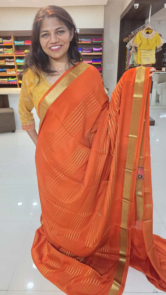 Mysore crepe silk sarees in KSIC Finish in orange self color lines pattern