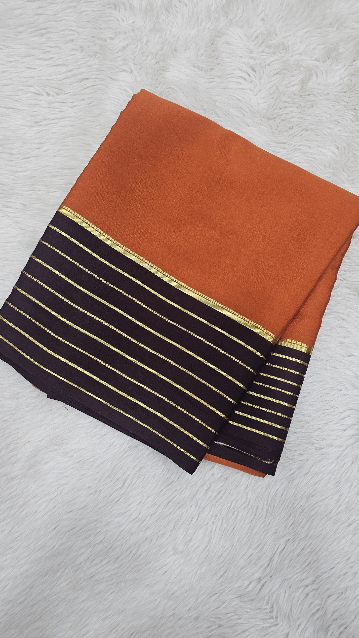 Mysore crepe silk sarees in KSIC Finish in rust orange with brown lines border