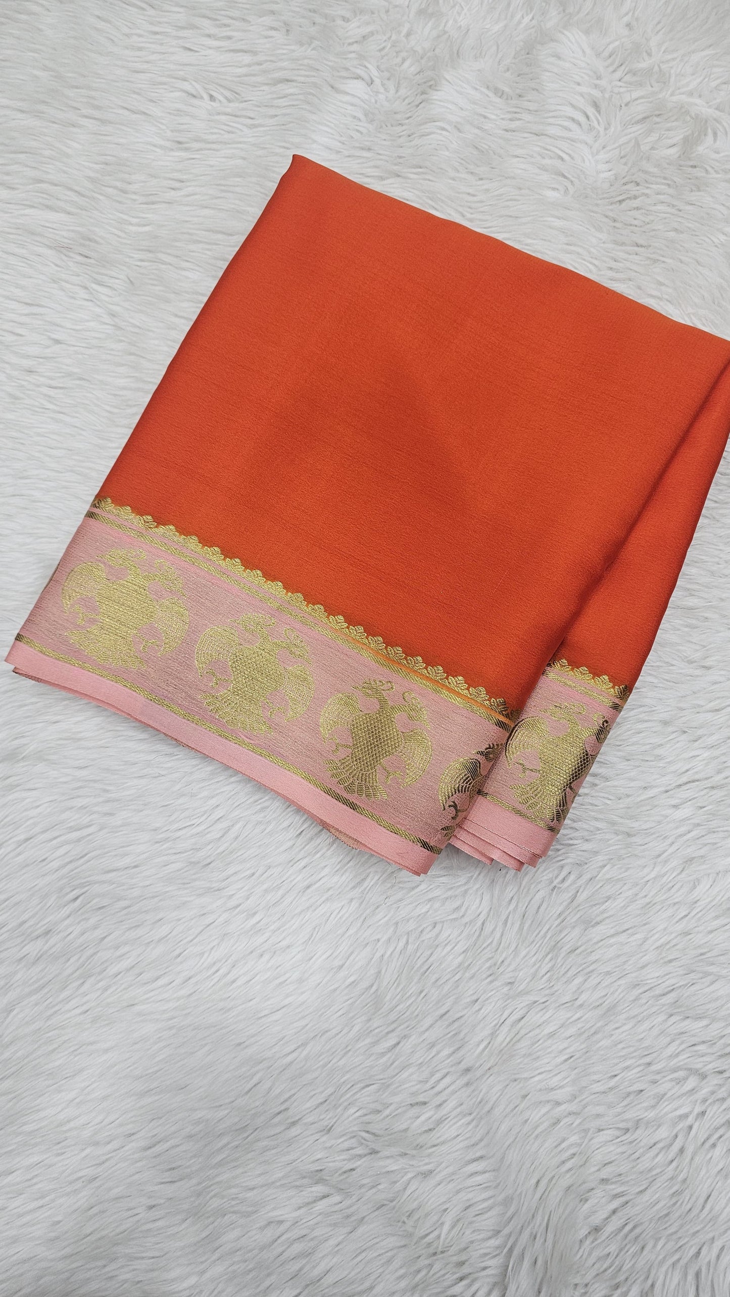 Mysore crepe silk saree in KSIC Finish in orange with light baby pink small ganda berunda border
