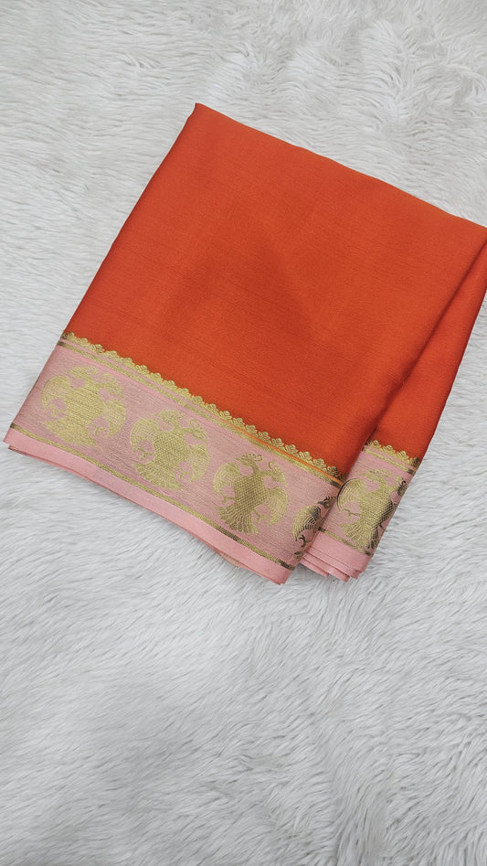 Mysore crepe silk saree in KSIC Finish in orange with light baby pink small ganda berunda border