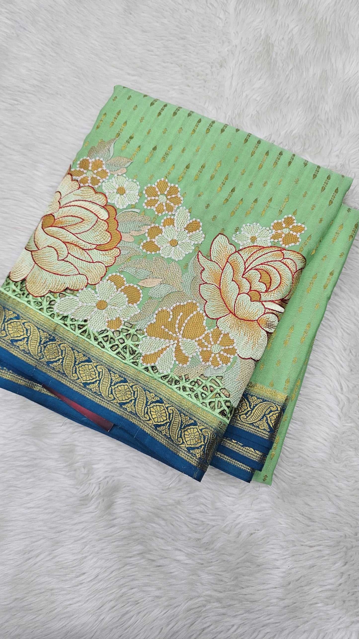 Mysore crepe silk saree in KSIC Finish in pista green with rama blue 1 sides cutwork