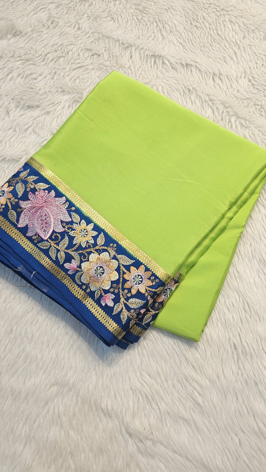 Mysore crepe silk saree in KSIC Finish in paroot green with peacock blue 2side embroidery