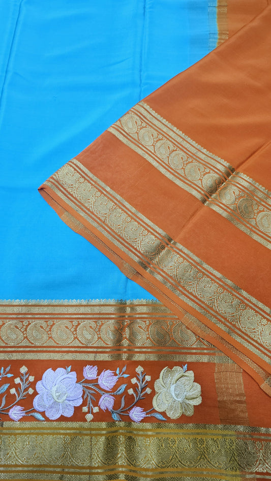 Mysore crepe silk saree in KSIC Finish in ananda blue with orange  embroidery pattern