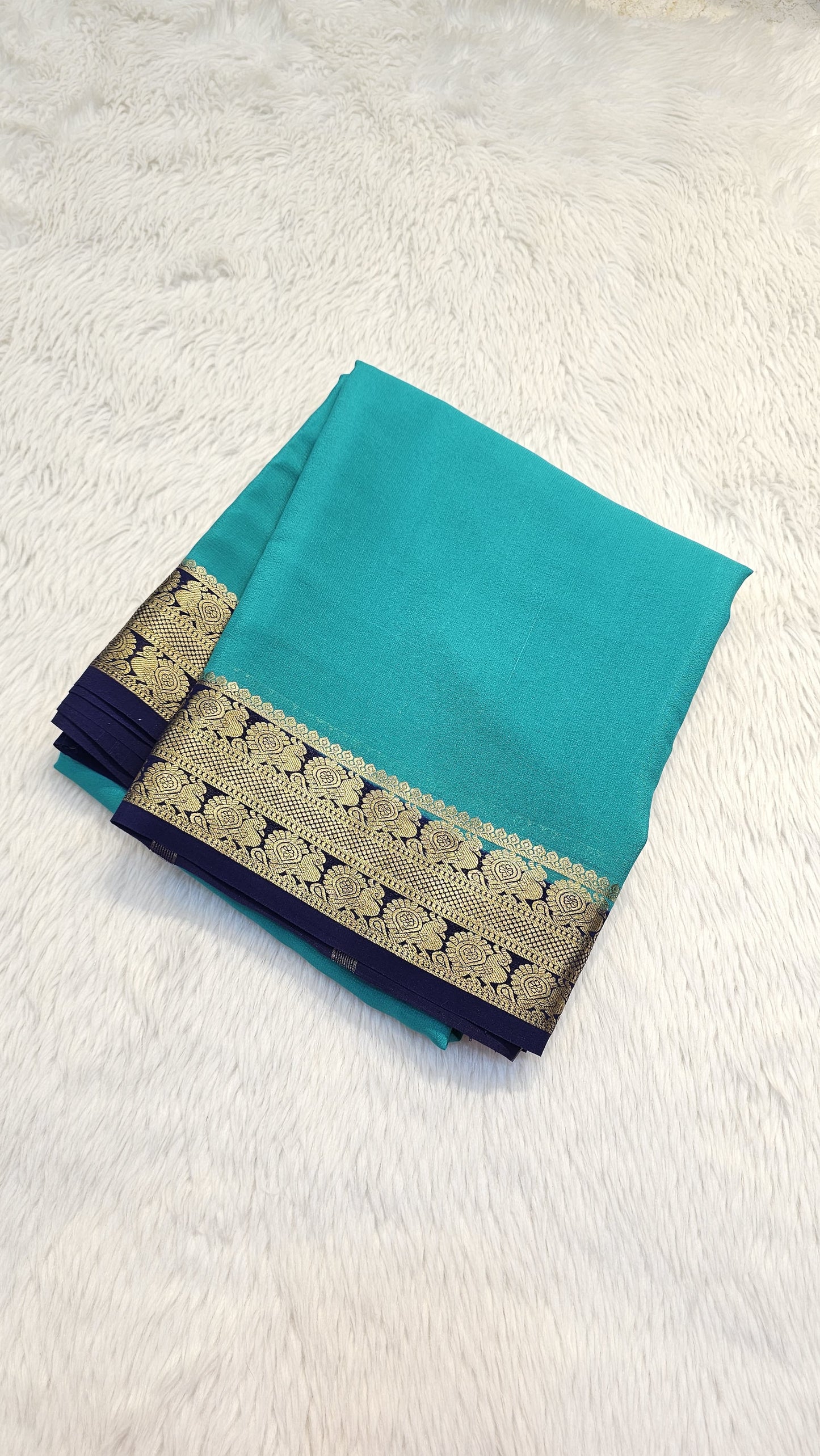 Mysore crepe silk saree with KSIC Finish in rama green with ink blue in peacock border