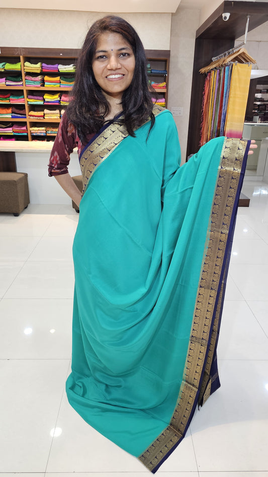 Mysore crepe silk saree with KSIC Finish in rama green with ink blue in peacock border