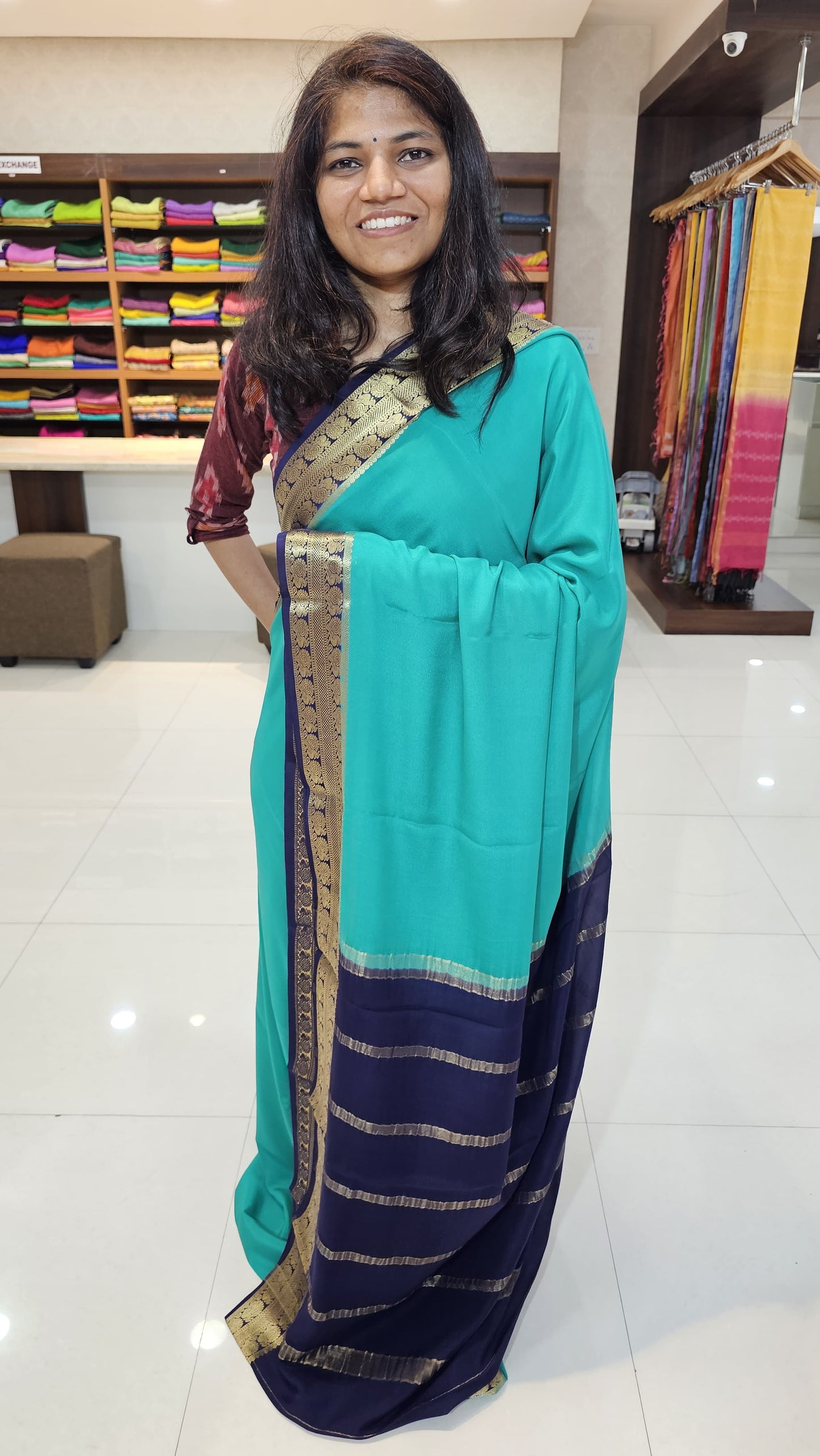 Mysore crepe silk saree with KSIC Finish in rama green with ink blue in peacock border
