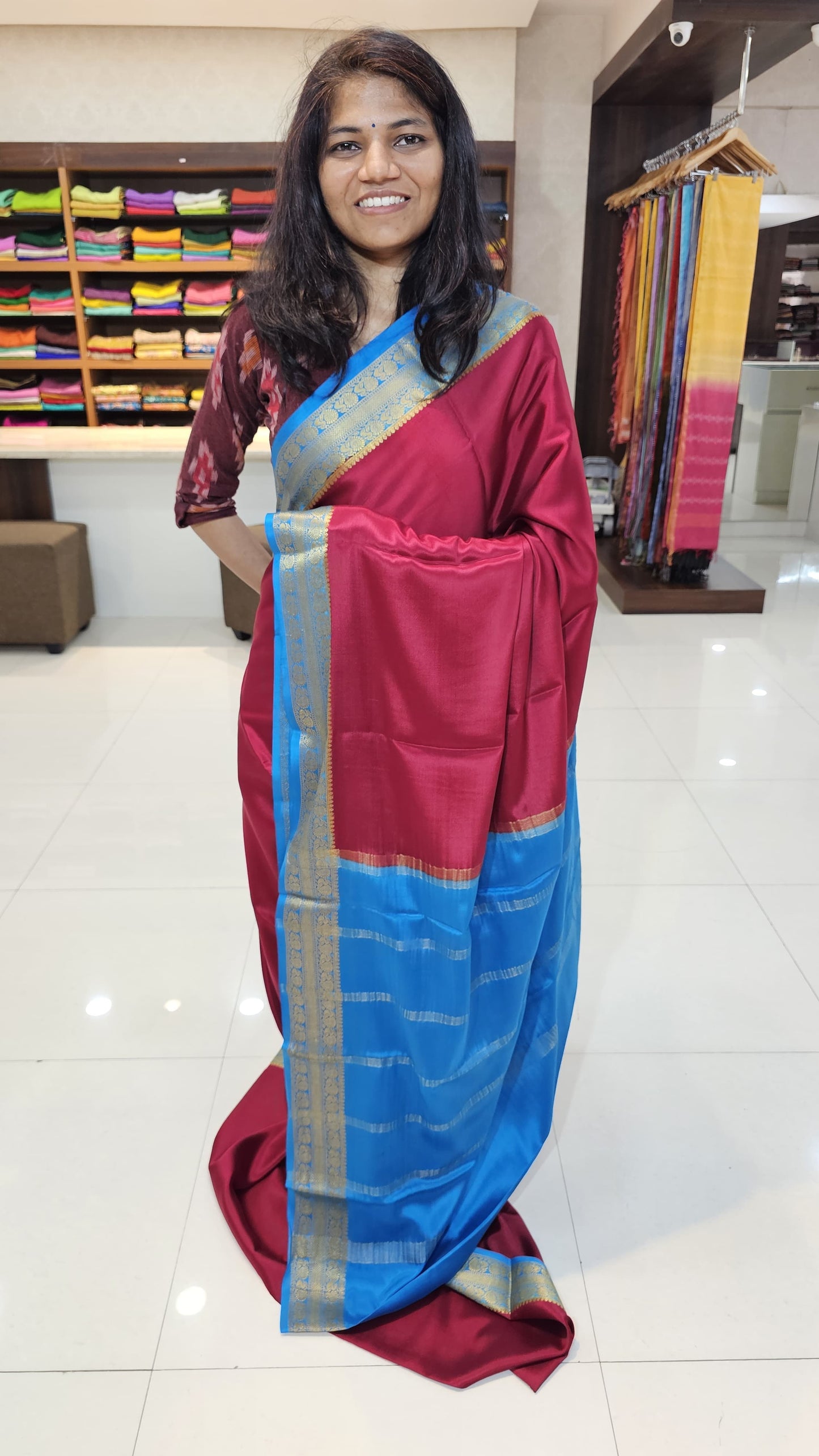 Mysore crepe silk saree with KSIC Finish in chilly red with ocean blue in peacock border
