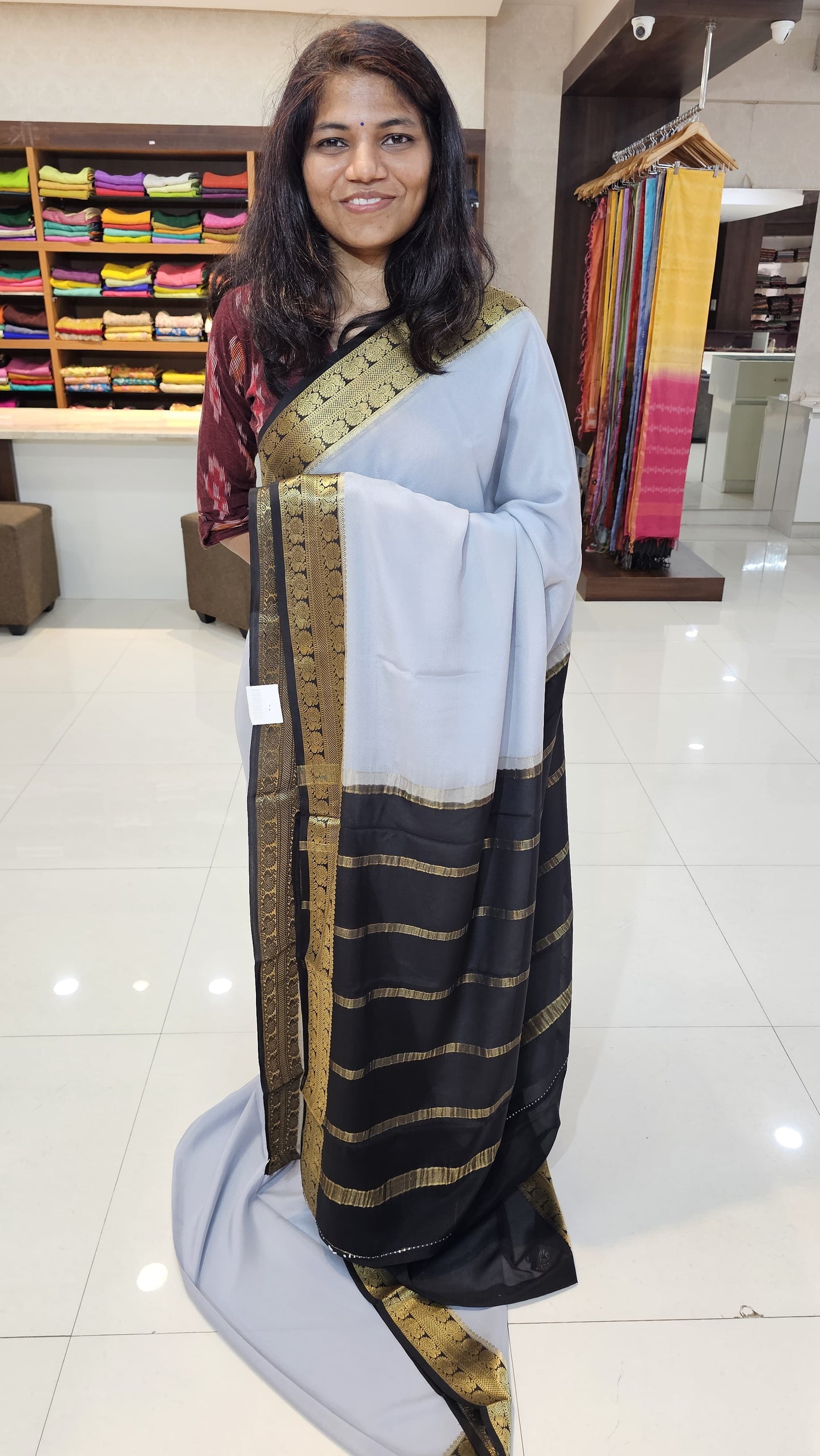 Mysore crepe silk saree with KSIC Finish in mist grey with black in peacock border