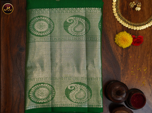 Kanchivaram Handloom Pure Silk in Butta Pattern in All Self Leaf green with Silver Zari long Border and Rich Pallu