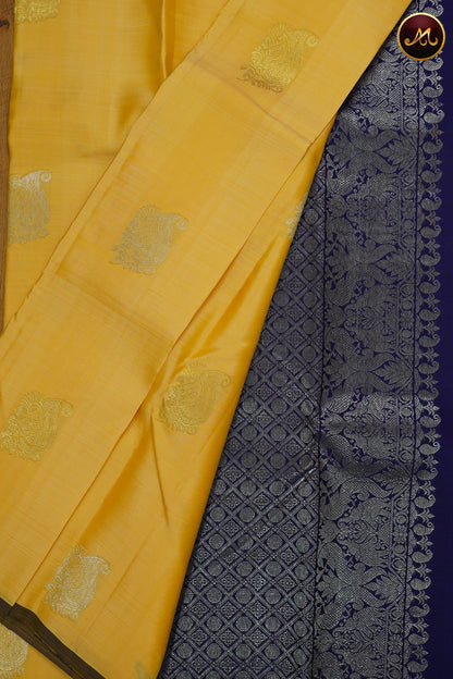 Kanchivaram Silk Saree in Yellow and navy Blue Combination with Silver and Gold Zari Motifs