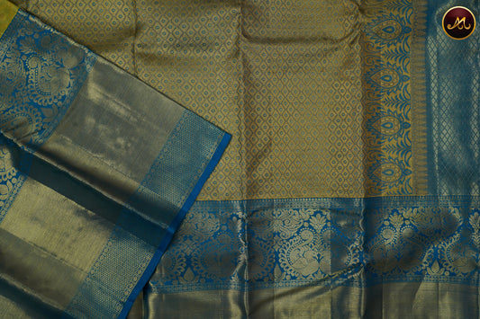 Kanchivaram Pure Silk Tissue Saree in parrot green and ananda blue combination with emboss work, long and short border in gold zari and rich pallu